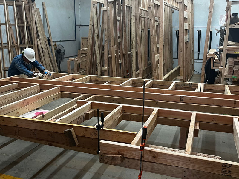 builder working on framing for a tiny home