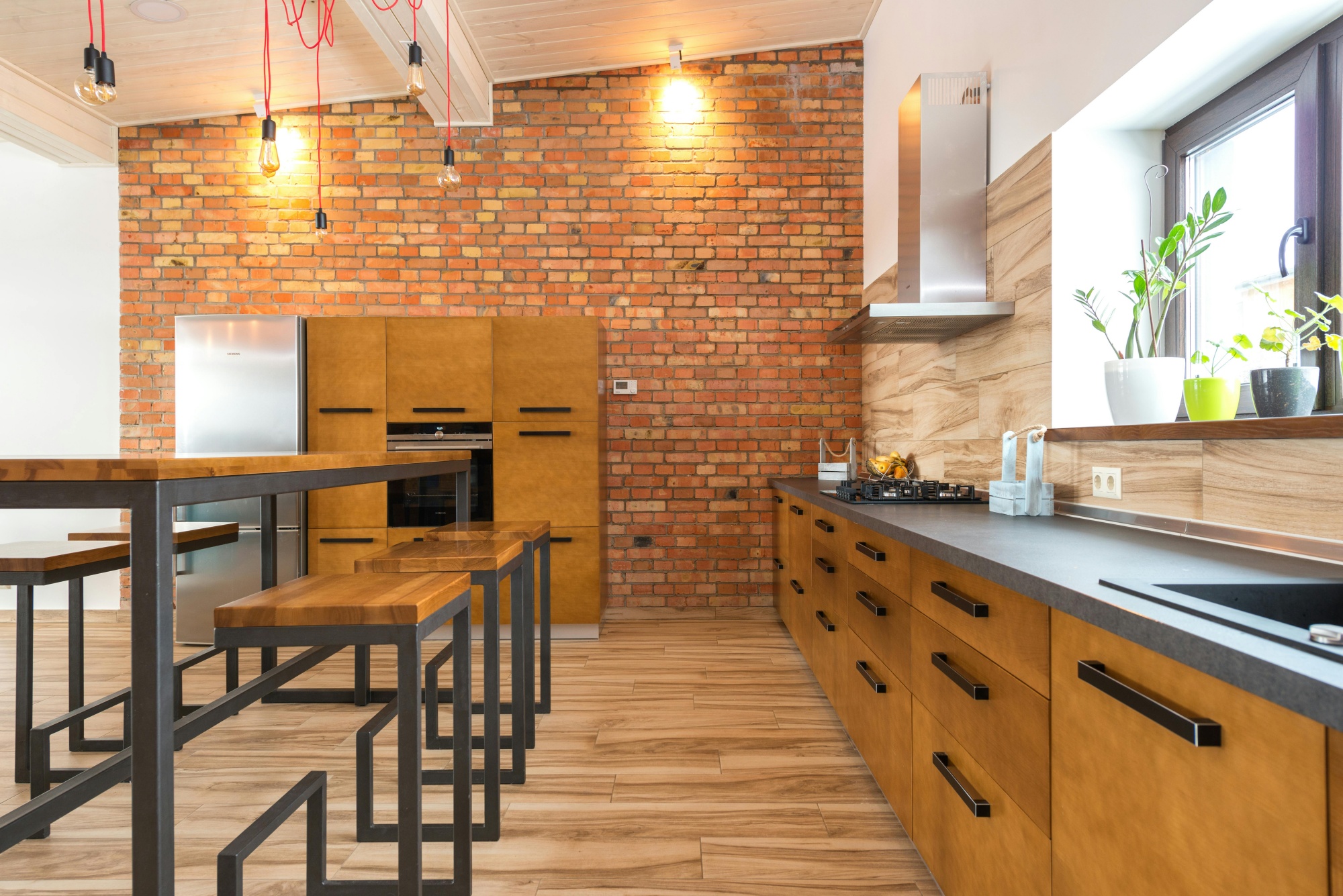 modern kitchen in a modular home featuring wood and brick accents