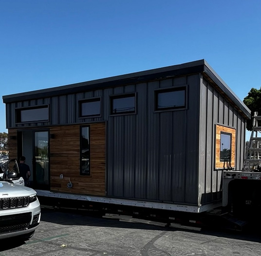 Modern tiny house being transported